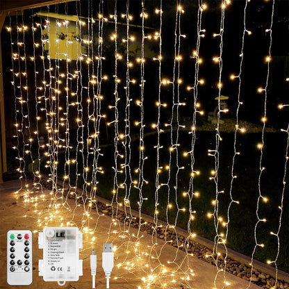 LE Curtain Lights Battery Powered, 3m x 3m 300 LED Warm White Fairy Curtain Lights, USB Powered 8 Modes Curtain Fairy Lights for Birthday Decorations, Wedding, Party, Garden, Bedroom, Remote Control